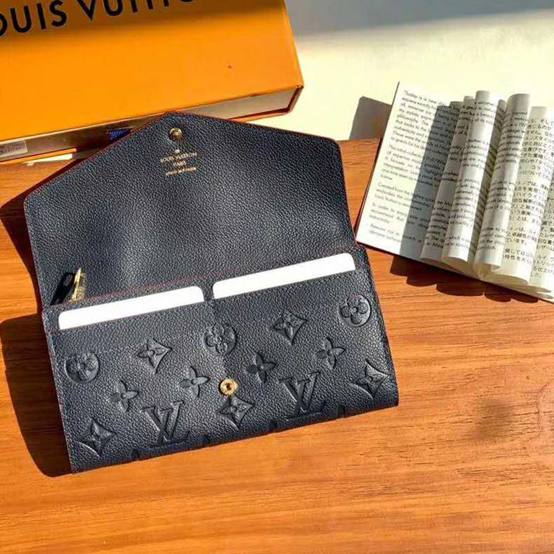 Louis Vuitton Navy Monogram Empreinte Leather Sarah Wallet.