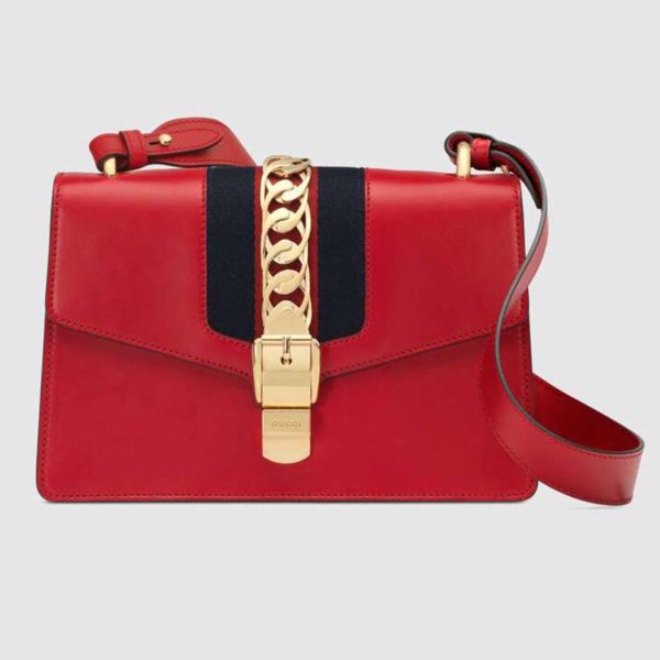red gucci wristlet