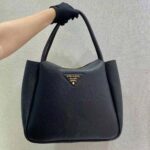 Prada Women Medium Leather Handbag with the Prada Metal Lettering Logo Illuminating Its Center-Black - Imagen 2