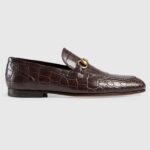 Mocassini Gucci unisex GG Jordaan in coccodrillo con lavorazione Blake, in pelle marrone con morsetto e tacco piatto da 1 cm.