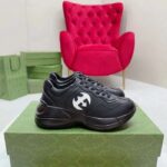 Gucci Unisex Interlocking G Rhyton Sneakers Black Leather White Cut-Out Rubber Sole - Image 2