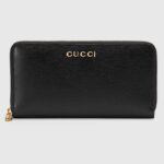 Cartera unisex Gucci con cremallera GG y tafetán de cuero negro con inscripción Gucci