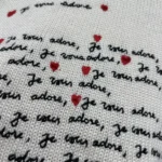 Dioramour Embroidered Sweater White Cashmere Knit with Black and Red Je Vous Adore Motif