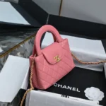 Chanel CC Mini Kelly Shopping Bag aus glänzendem, gealtertem Kalbsleder in Pink
