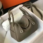 Hermes Women Lindy Mini 19 in Clemence Leather-Etoupe