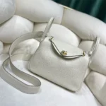 Hermes Women Lindy Mini 19 in Clemence Leather-White/Gold