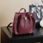 Chanel Women Chanel 25 Medium Backpack Grained Calfskin & Gold-Tone Metal-Maroon