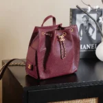 Chanel Women Chanel 25 Medium Backpack Grained Calfskin & Gold-Tone Metal-Maroon