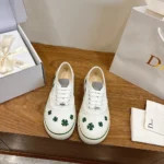 Dior Unisex Saltwind Sneaker White Cotton Embroidered with Bright Green Dior Clover Motif