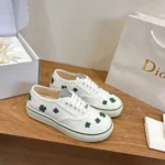 Dior Unisex Saltwind Sneaker White Cotton Embroidered with Bright Green Dior Clover Motif