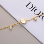 Dior Women CD Disco Bracelet Gold-Finish Metal White Resin Pearl and Crystals