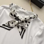 White 100% cotton interlock jersey 100% silk insert Signature print