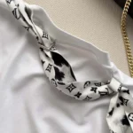 White 100% cotton interlock jersey 100% silk insert Signature print
